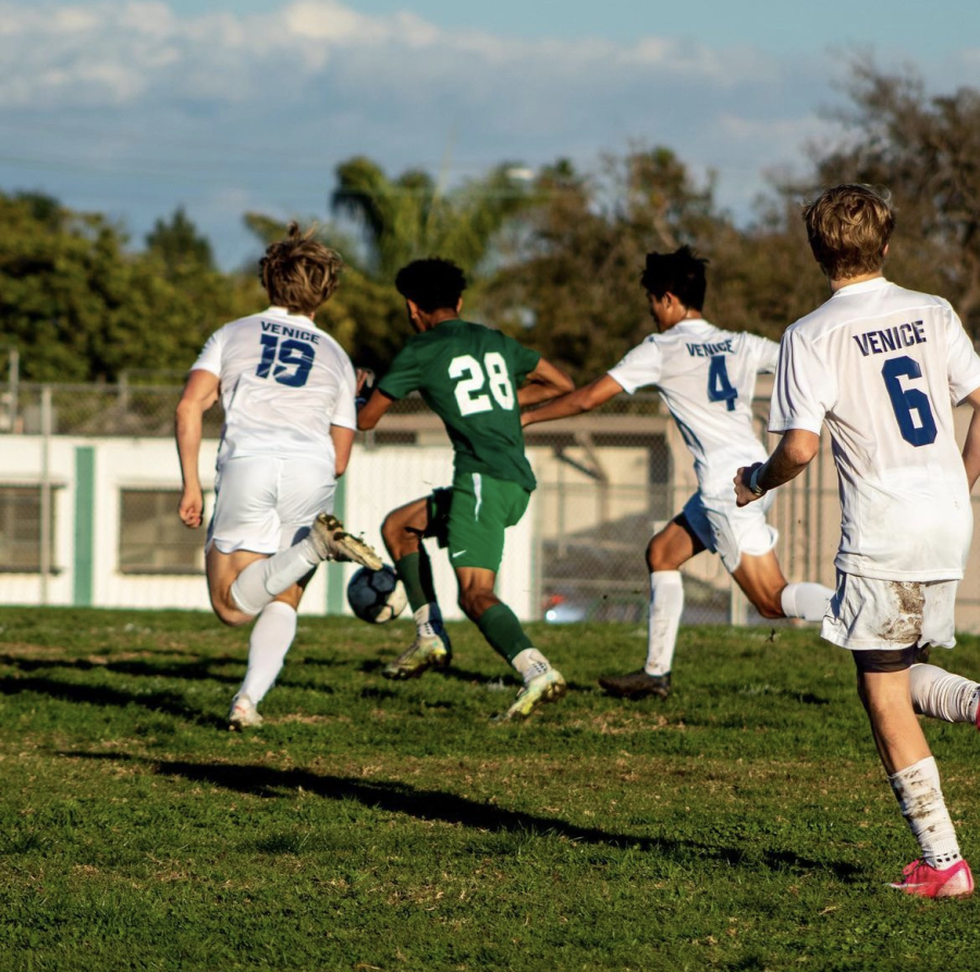 Blake Higgins, wearing the green 28 jersey, counterattacks in a home game against Venice.