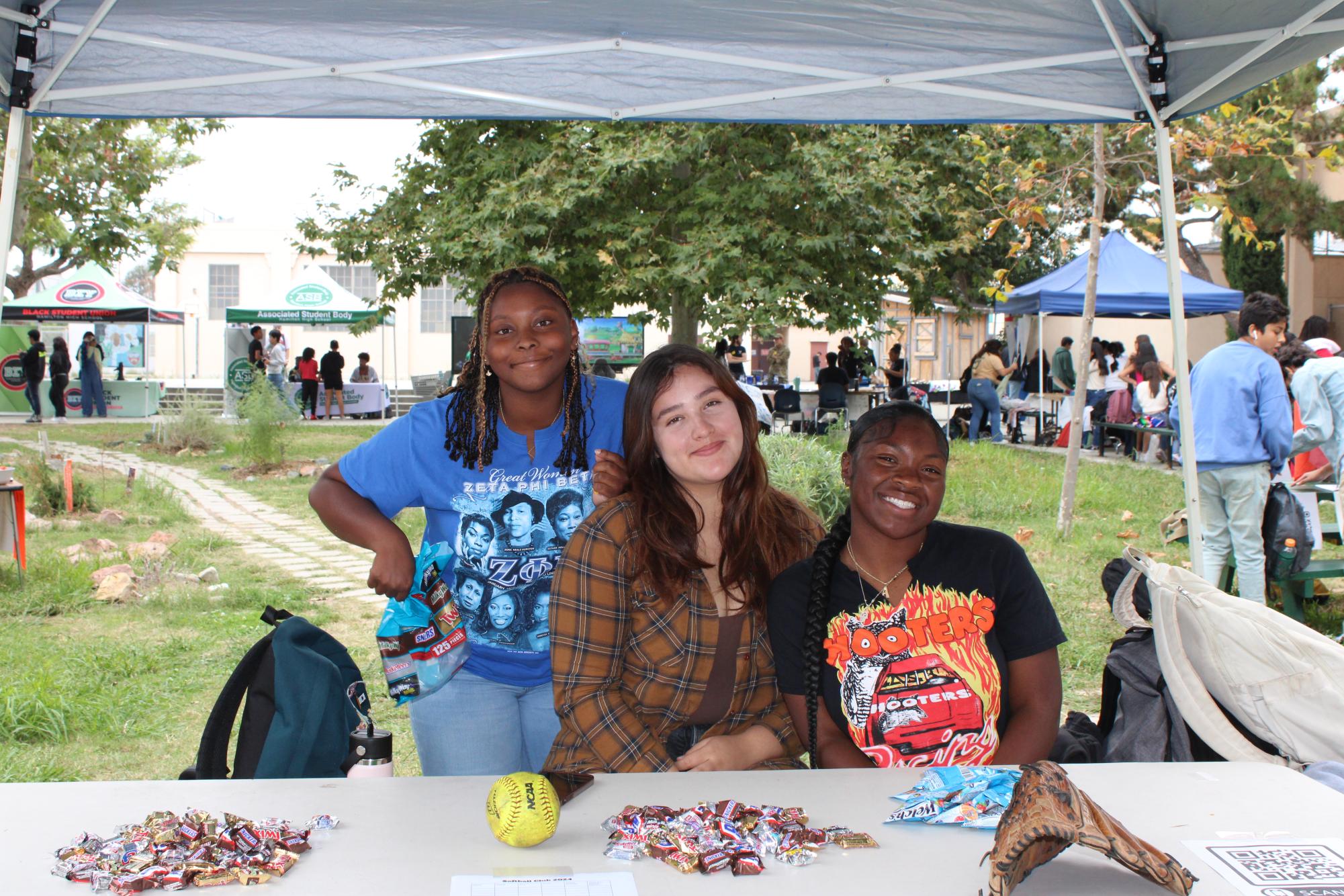 Students run their booth at Club Rush. Sixty-one clubs set up tables to recruit new students.