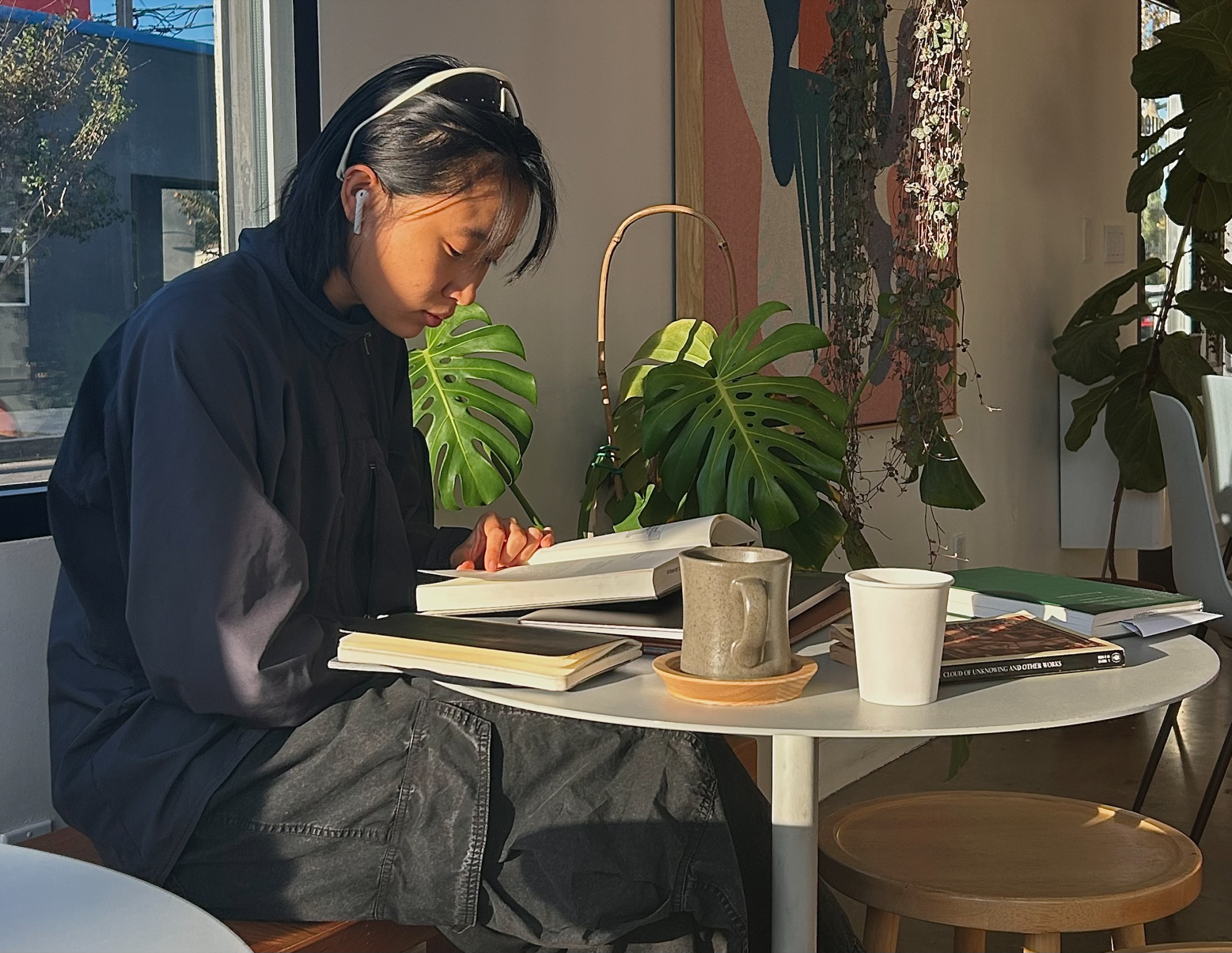 A customer at Eyes Peeled Coffee listens to music while enjoying a drink.