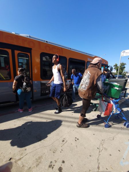 Hamilton students and other Los Angeles residents board and exit a Metro bus.