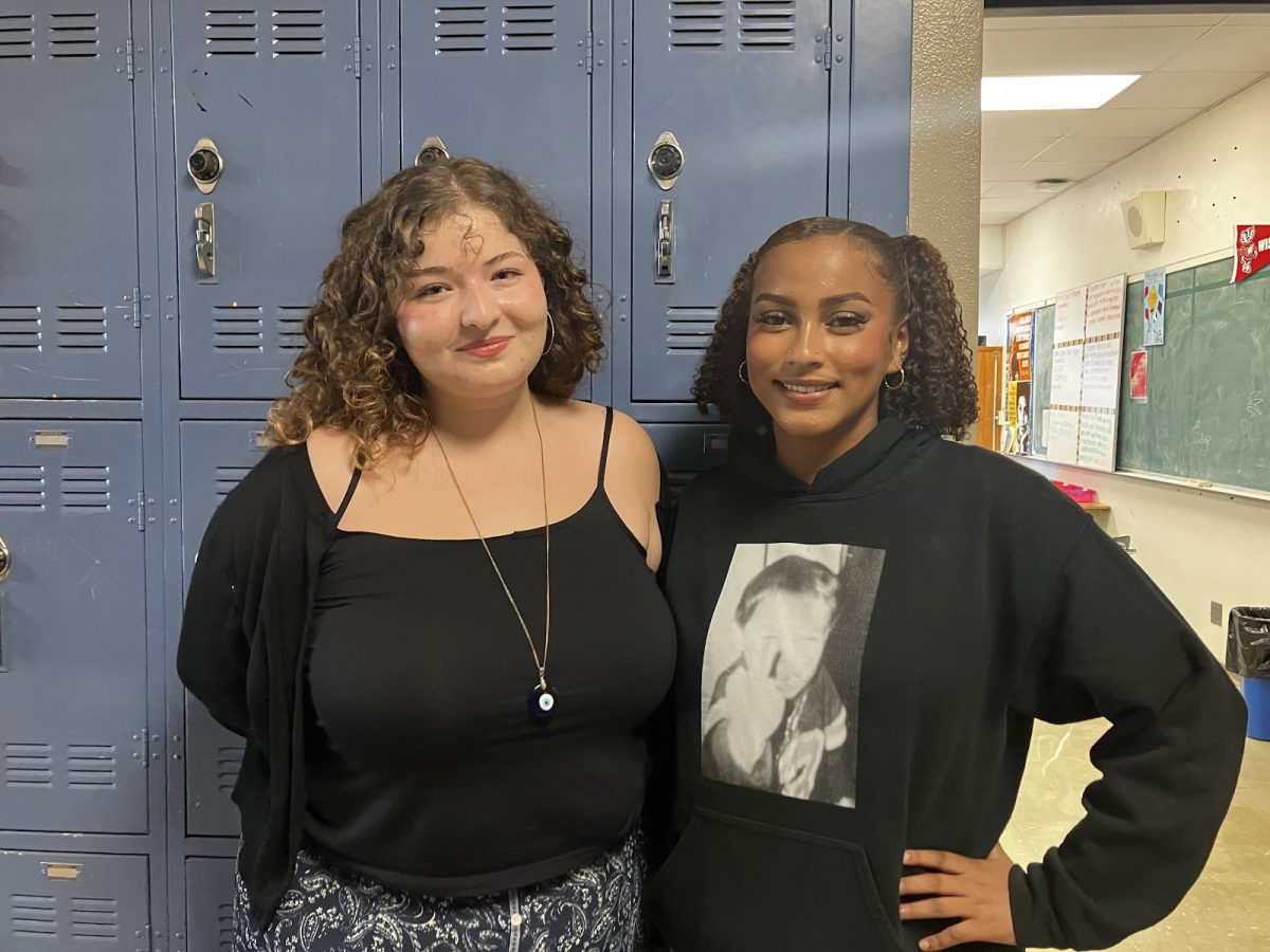 Club president Merah Bleibel and vice president Nazya Grant pose in front of Ms. Colson's room, where the Divine Femininity Club meets.