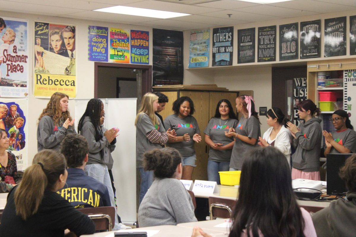 AMPA students introduce themselves to future parents and students.