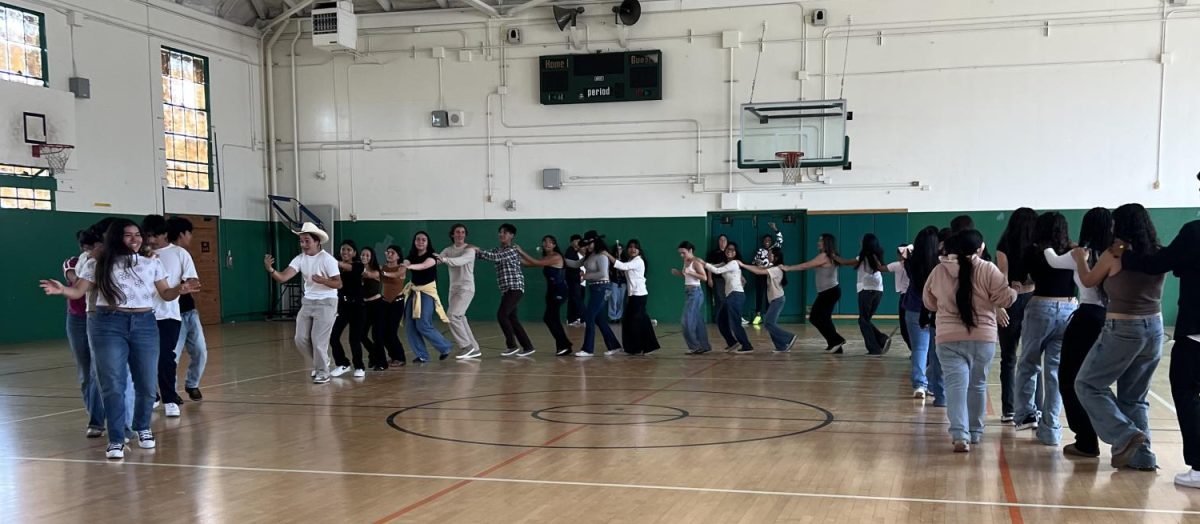 Students enjoy a conga line to end off the L.A.S.O dance.