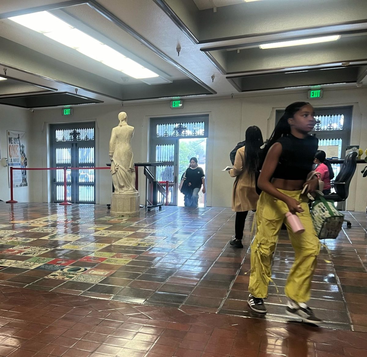 Students make their way to class after scanning their ID at the door.