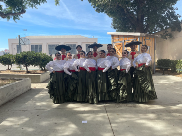 The Folklorico dance team poses in the quad next to the outdoor stage.