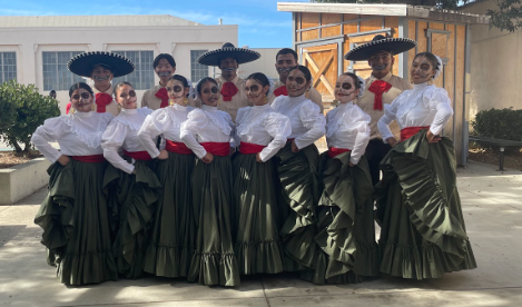 The Folklorico dance team poses in the quad next to the outdoor stage.