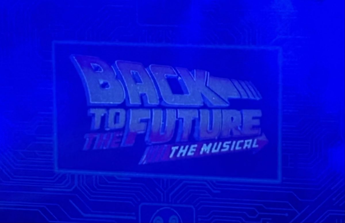 The Back to the Future logo is projected onto the closing curtain before the show.