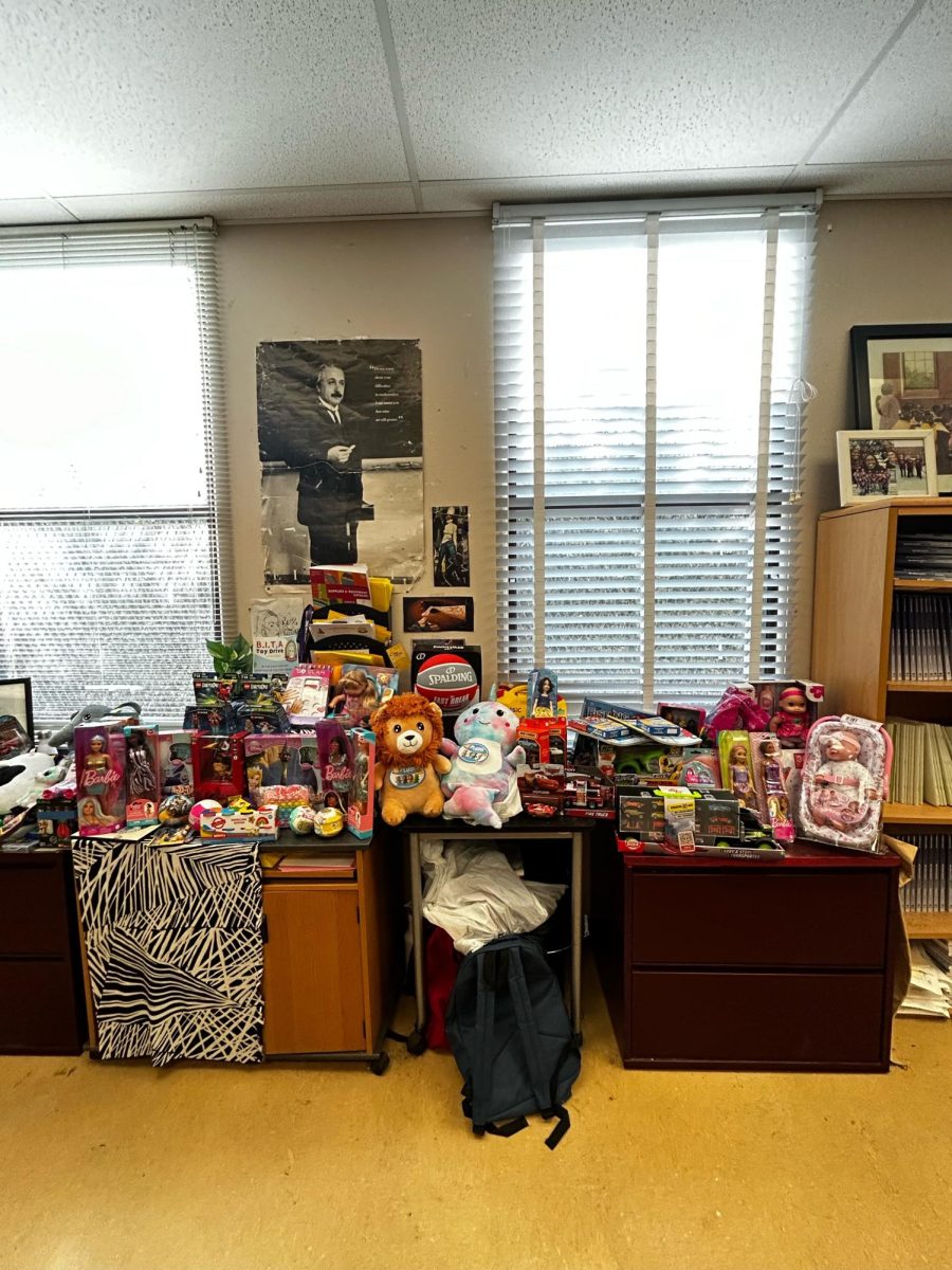 Presents for the toy drive are piled in Ms. Cooley's classroom.