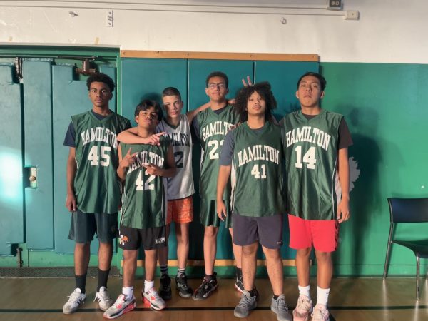 The frosh soph basketball team poses for a photo.