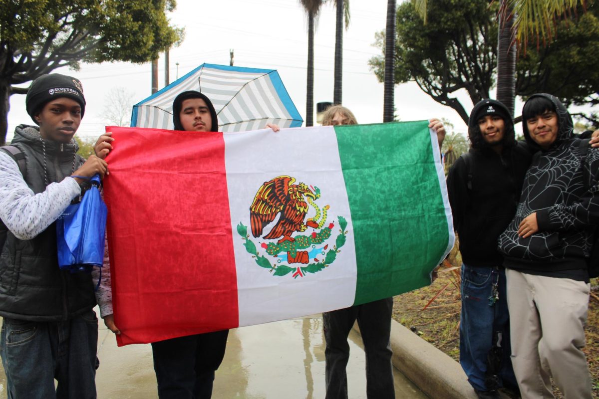 Students display a Mexican flag.