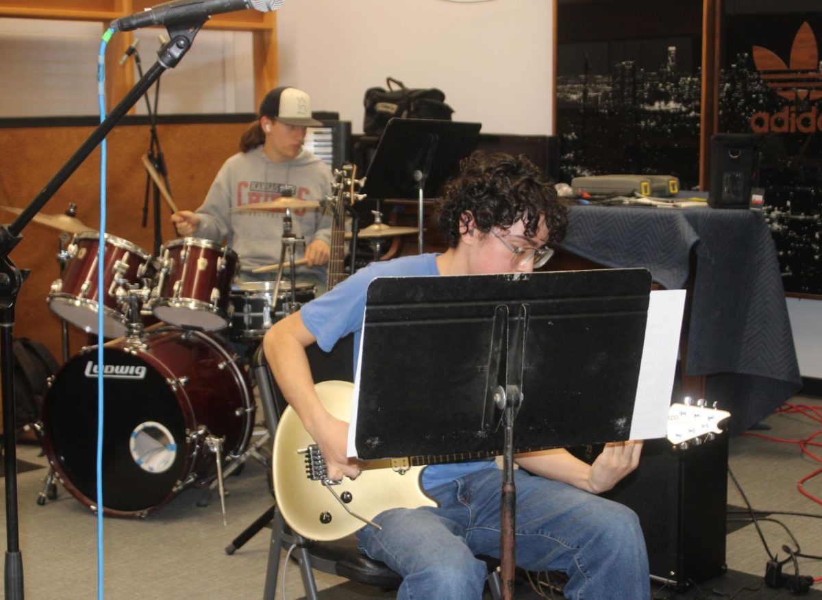 Two students on the Make Waves label rehearse their pieces for Equinox.