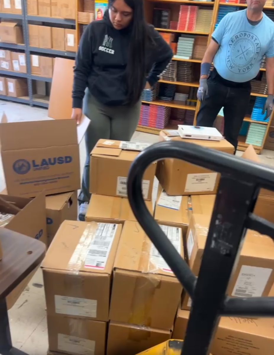 Students with assigned community service work in the textbook room to make up their hours on Saturday.