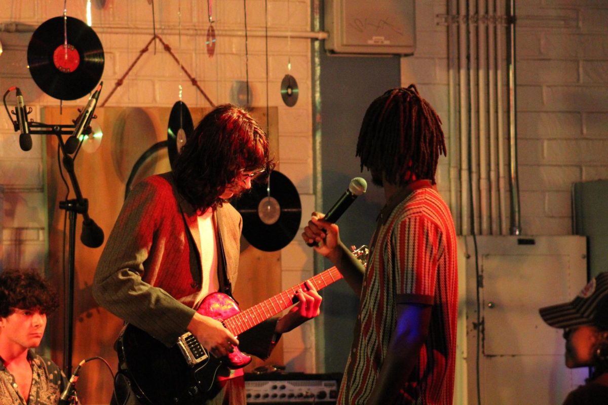 Angus Campbell-Grossman and Saxon Johnson performing on stage.