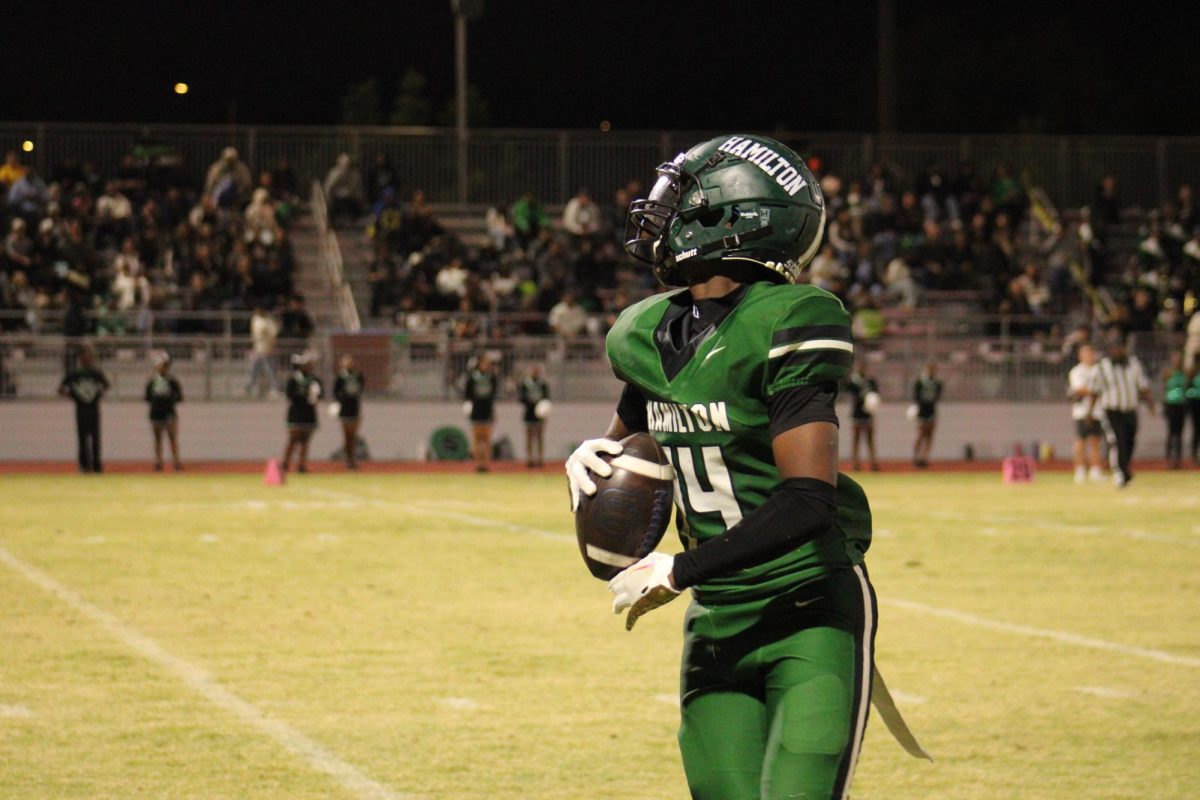 #14 Le'Kai Morgan runs out of bounds after yardage gain. 