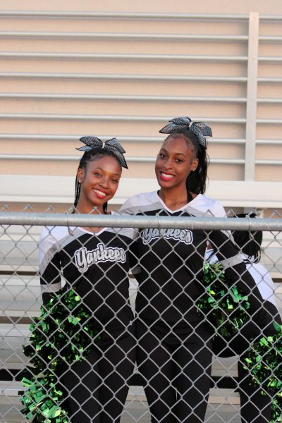 Dance team athletes Kimora Johnson and Sequoia Gibson pose for a photo before the game begins.