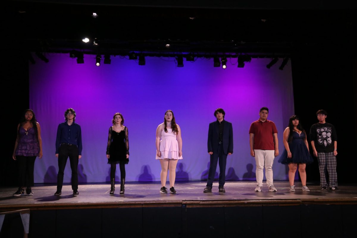 (from left to right) Syriah Howard, Braiden Schwartz, Lucinda Jones, Robin Chorna, Wyeth Sander, Pharez Figueroa, Dulce Gonzalez, and Lorenzo Pagan on stage for the senior number "No One is Alone." 
