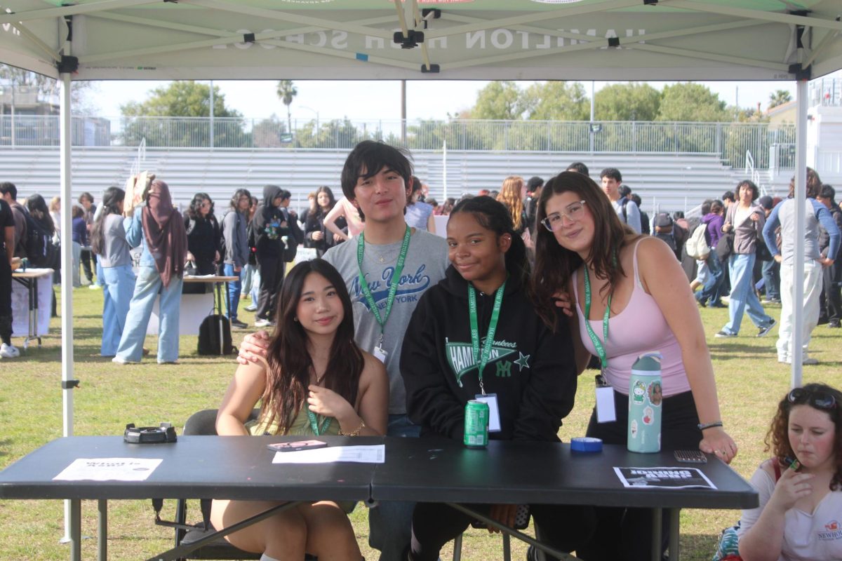 Senior ASB officers pose for a photo in front of their booth for club rush. As second semester moves along, ASB is looking for new people to start running for positions for the 26-27' school year. 