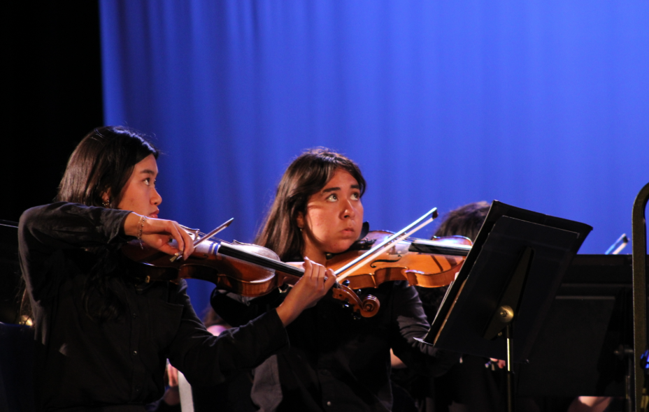 First stand violinist Cesia Guzman is on stage for the orchestral arrangement of West-Side Story. 