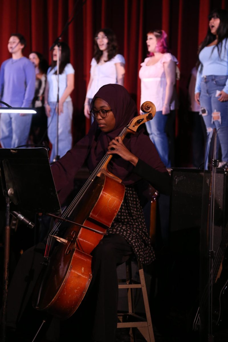 Ama Boateng plays the cello during the bella chior's rendition of Time After Time by Cindy Lauper. Ama is an AMPA senior. 