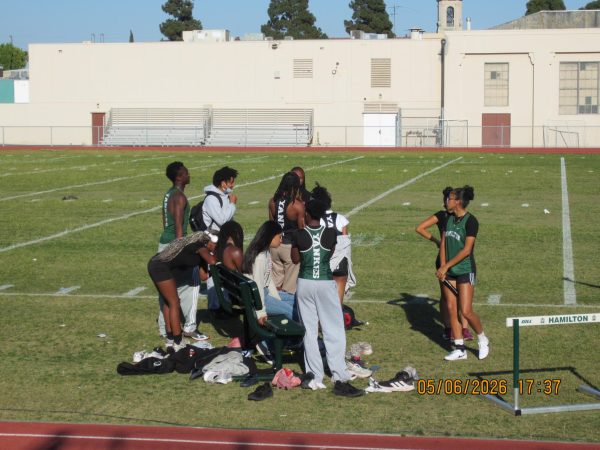 Hamilton's track team waits on the field has their races commence during a track meet on April 23. As of now, a few members of the team are qualified to compete at the state level. 