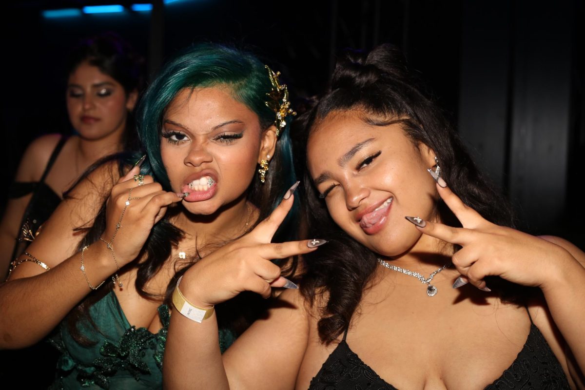 Jolie Desvignes and Jade Sims pose for a photo during the dance.